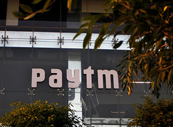 What prompted Paytm to roll back 2% fee on wallet top-up via credit cards?