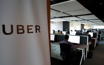 Uber shrinks quarterly loss, plans new share sale