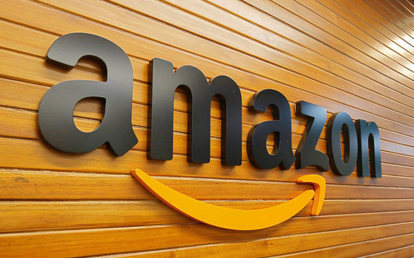 Amazon reports lower profit, invests in one day shipping, cloud infrastructure